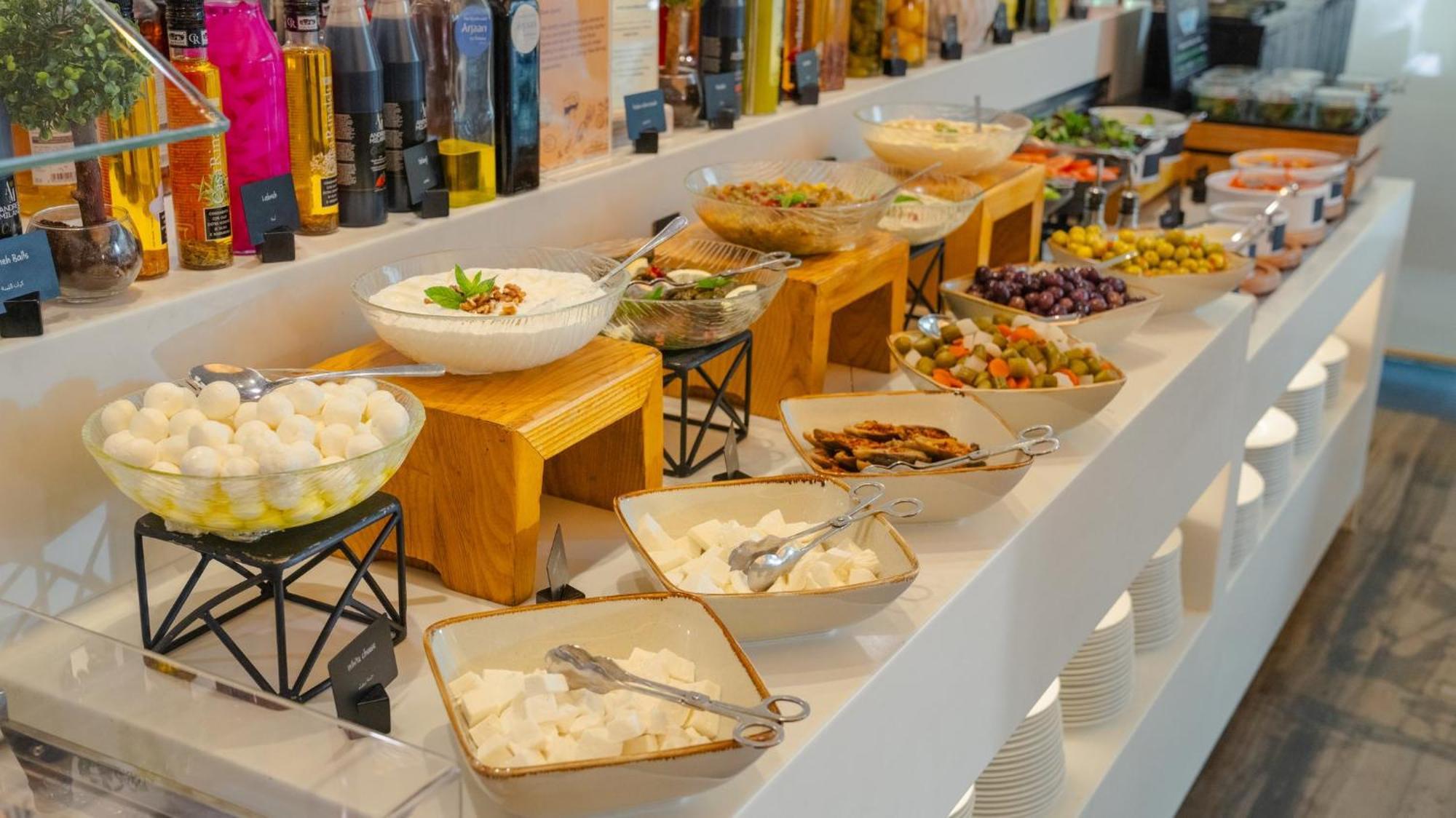The Abdali Boulevard Hotel Амман Экстерьер фото A selection of Greek meze